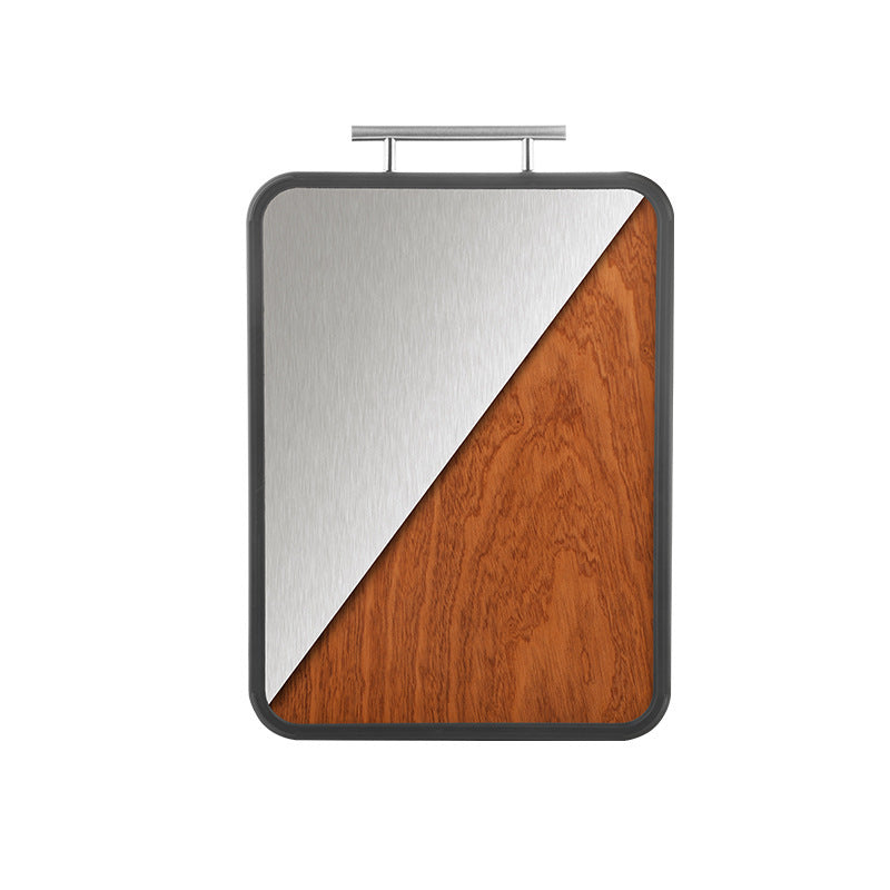 Close-up of the cutting board’s ebony and titanium surface, highlighting its antibacterial properties.