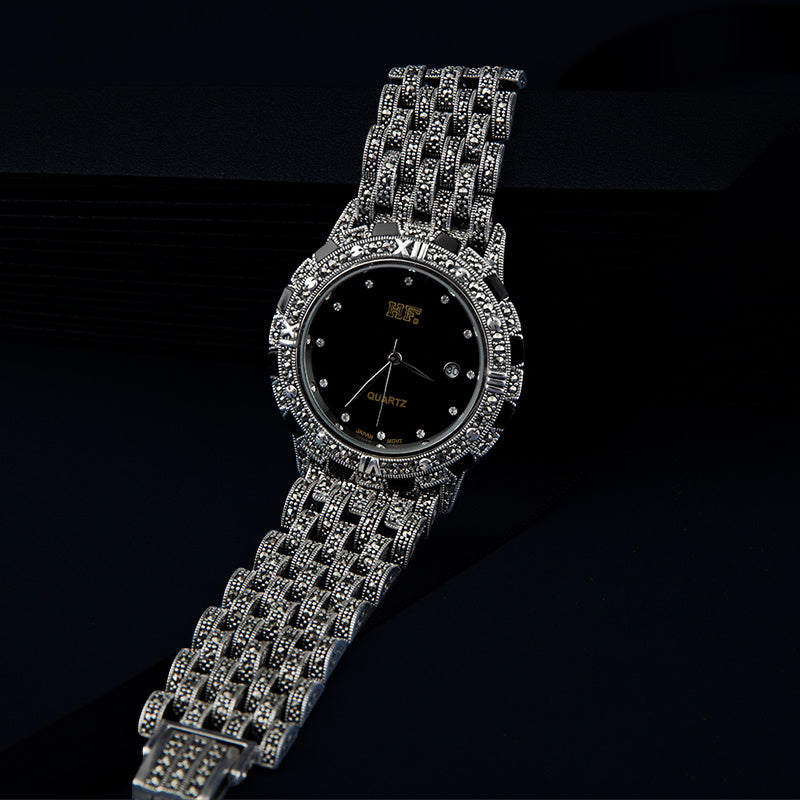 European luxury quartz watch featuring a white dial and metal strap.