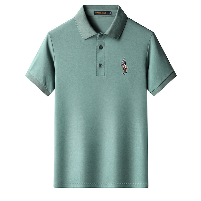 Green embroidered polo tee worn with jeans for casual outfit