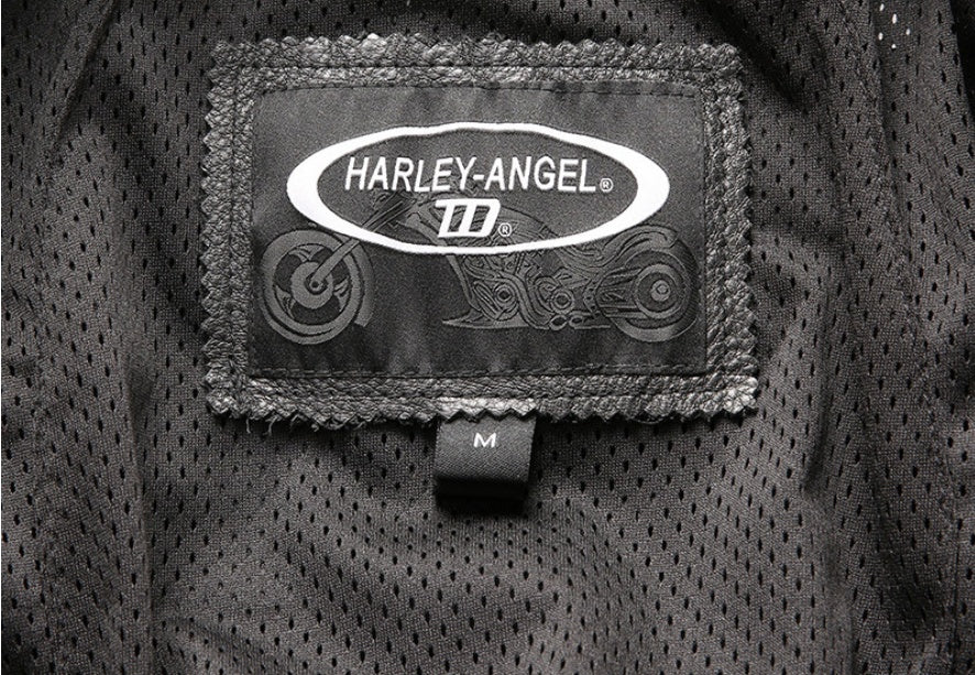 Close-up of premium cowhide leather used in men's motorcycle jacket with cotton lining.