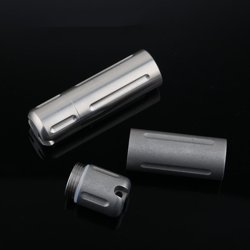 Interior view of titanium pill box showing sealed inner chamber