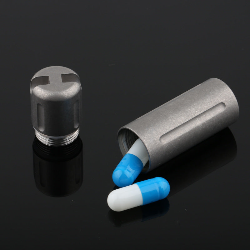Titanium pill box with attached stainless steel keyring for EDC