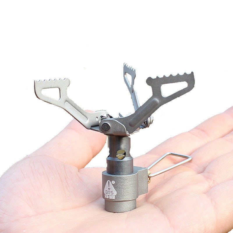 Silver titanium gas stove designed for picnics, hiking, and outdoor survival needs.