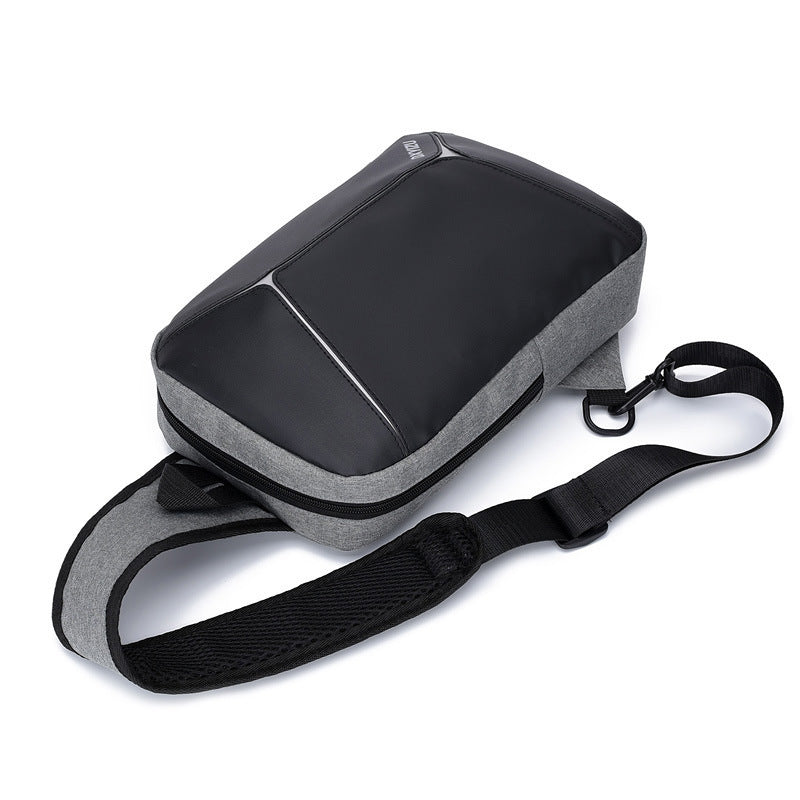 Close-up of USB charging feature on men’s messenger bag