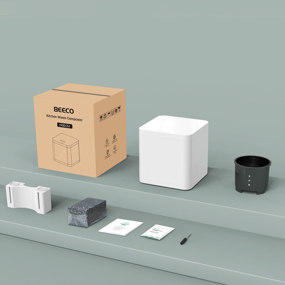 Unboxed BEECO™ kitchen composter with accessories and user manual
