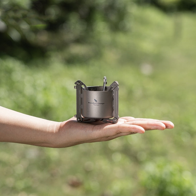 Titanium stove actively burning alcohol outdoors