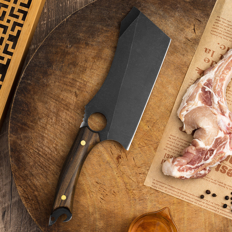 Black titanium ring knife with a protective blade sheath for safe storage.
