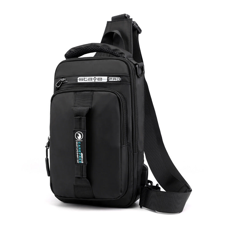 Man wearing gray waterproof tech backpack in urban environment