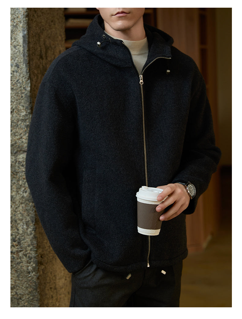 Detailed close-up of the hood design on the men’s woolen coat showing its warm and stylish structure.