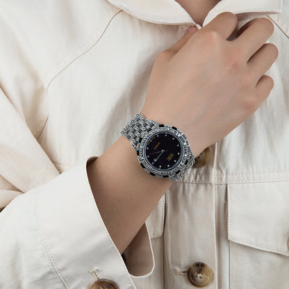Detailed view of the black dial European luxury quartz watch with a metal band.