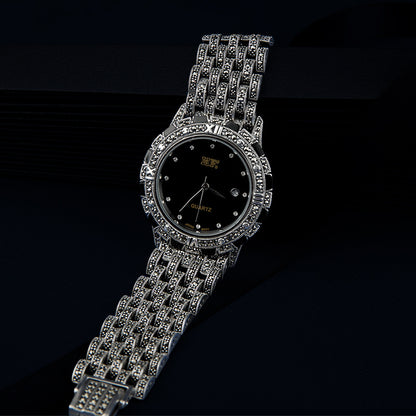 European luxury quartz watch featuring a white dial and metal strap.