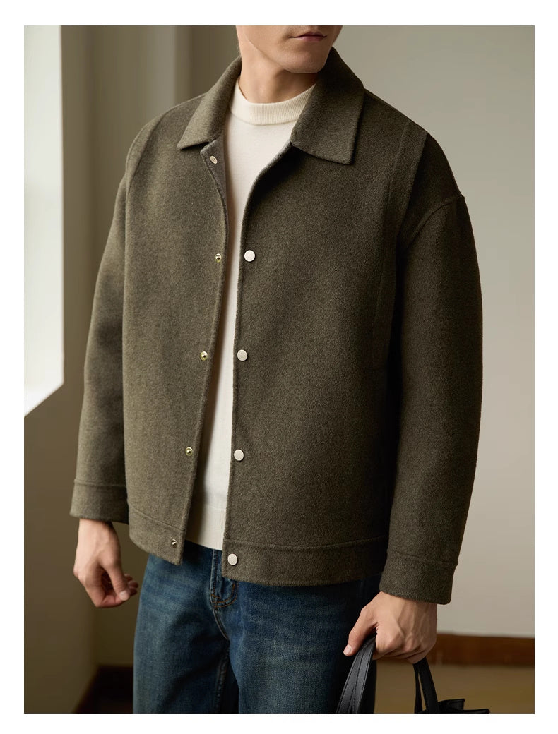 Close-up of the double-sided fabric on the men’s woolen coat, highlighting its soft and durable texture.