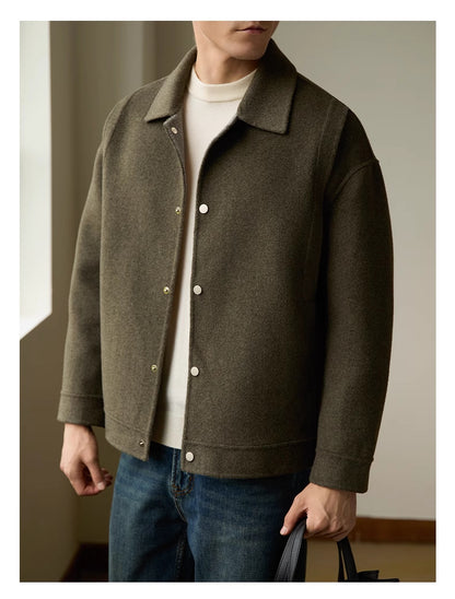 Close-up of the double-sided fabric on the men’s woolen coat, highlighting its soft and durable texture.