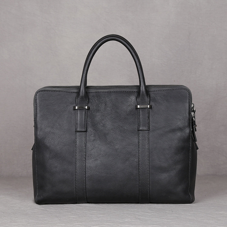 Vintage vegetable-tanned leather men's handbag with top-layer cowhide and secure zipper closure.