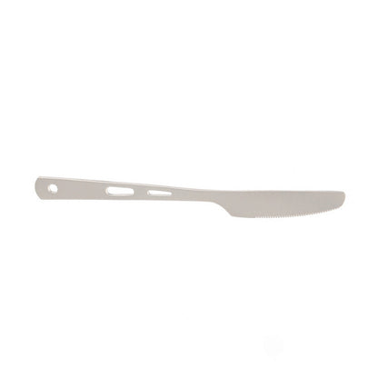 Complete titanium cutlery set displayed on rustic wooden surface