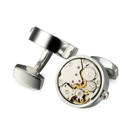 Close-up of functional steampunk cufflinks featuring intricate gear and clockwork designs.