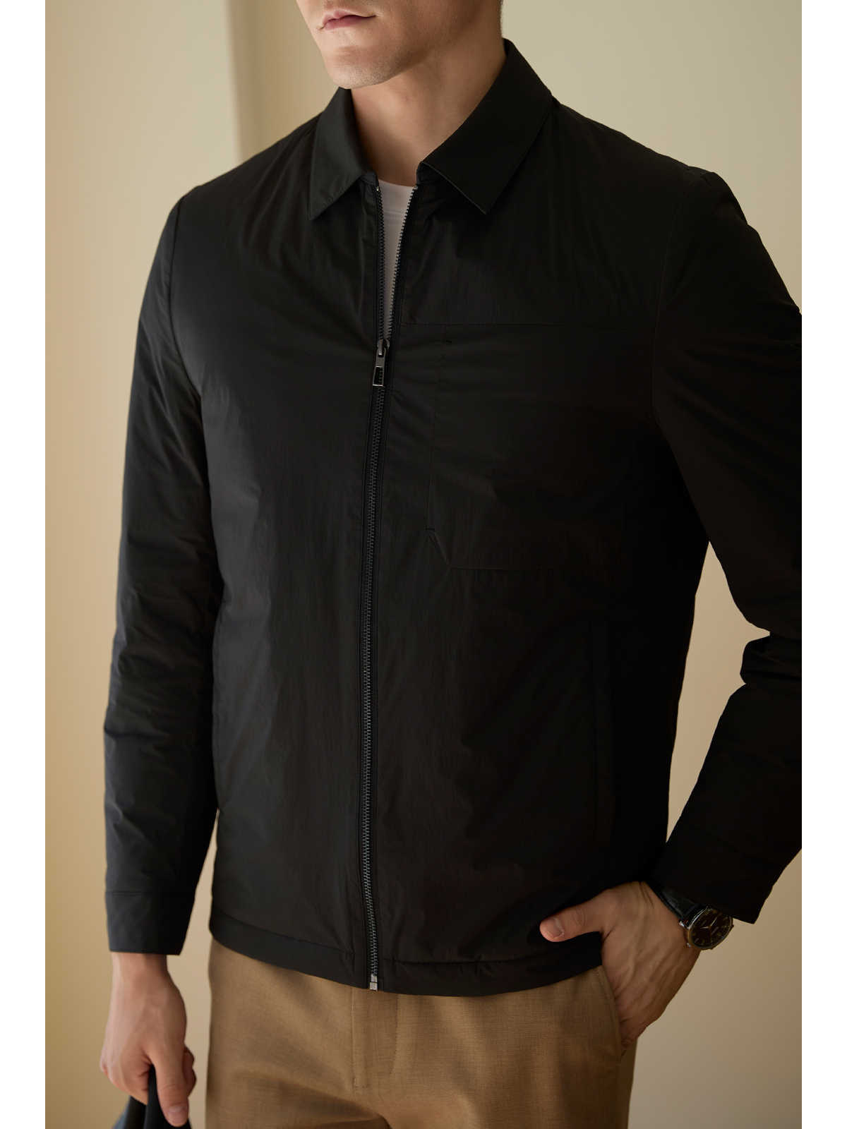 Side angle of the short khaki down jacket for men, featuring a lapel and zipper front
