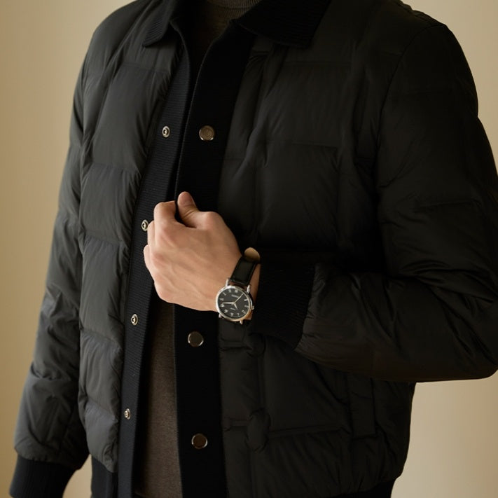 Front view of the men’s luxury urban patchwork short coat in black
