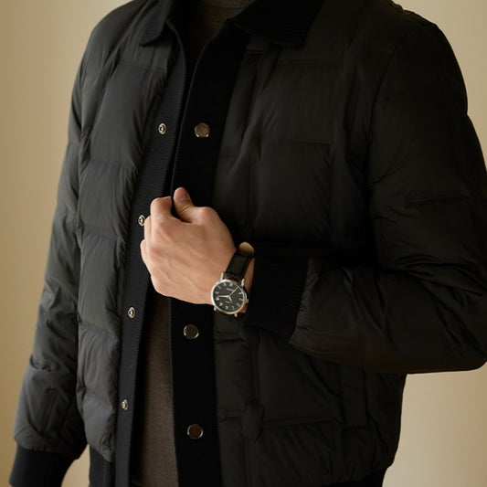 Front view of the men’s luxury urban patchwork short coat in black