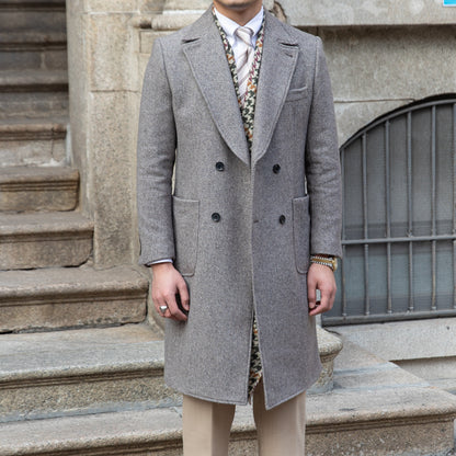 Full-length view of a grey double-breasted wool coat, perfect for formal and casual settings.