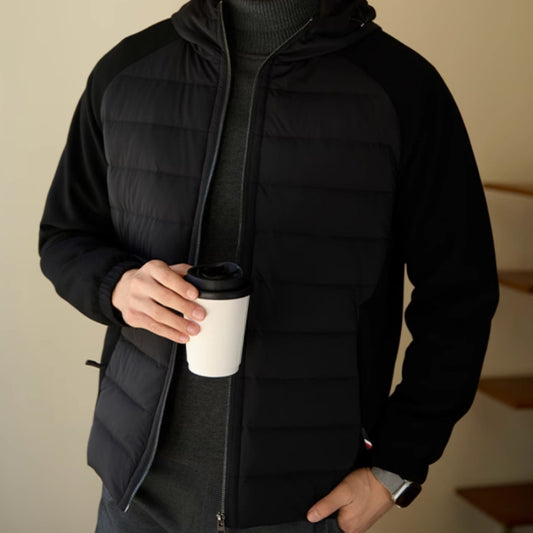 Front view of the men’s lightweight hooded down jacket with modern colorblock design