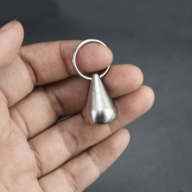 Mini titanium alloy vial with a sleek silver finish, perfect for outdoor use.