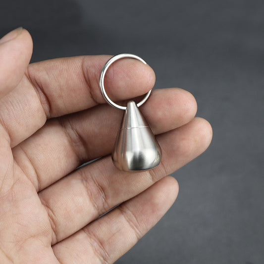 Mini titanium alloy vial with a sleek silver finish, perfect for outdoor use.