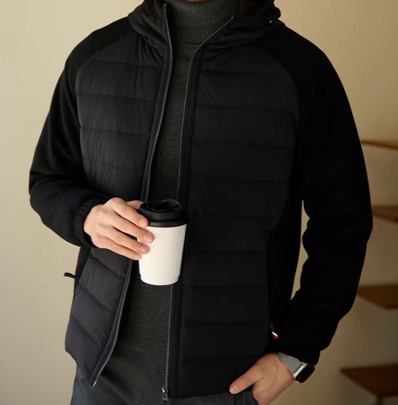 Man wearing the modern down jacket in an outdoor setting, showcasing its urban style