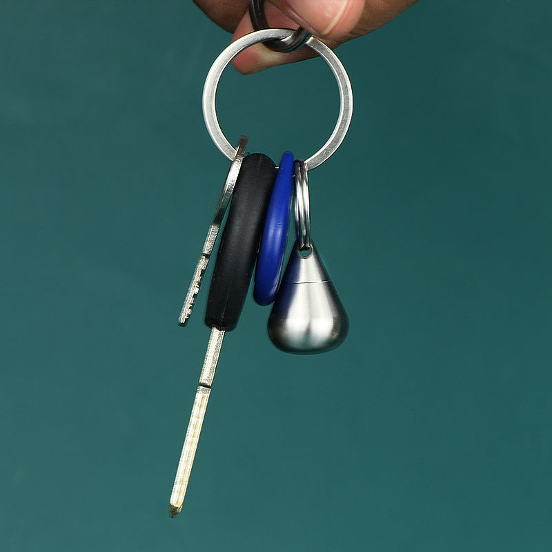 Multi-functional silver titanium bottle ideal for medicine or spice storage.