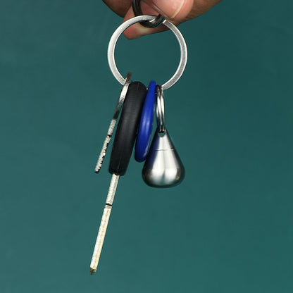 Multi-functional silver titanium bottle ideal for medicine or spice storage.