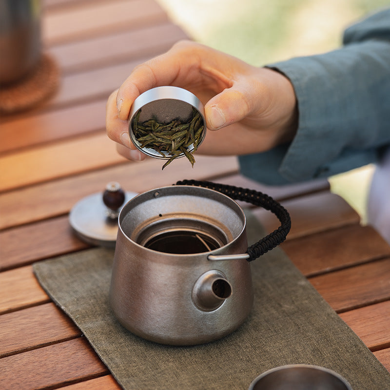 Outdoor tea brewing using the Wild Wind Titanium Tea Set.