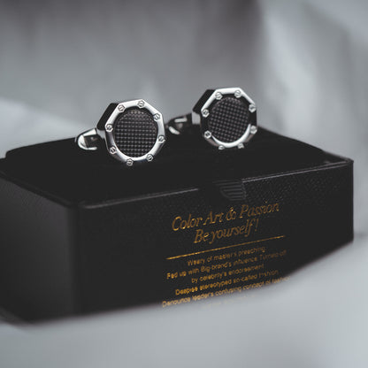 Close-Up of Polished Silver Steel Cufflinks with Black Accents