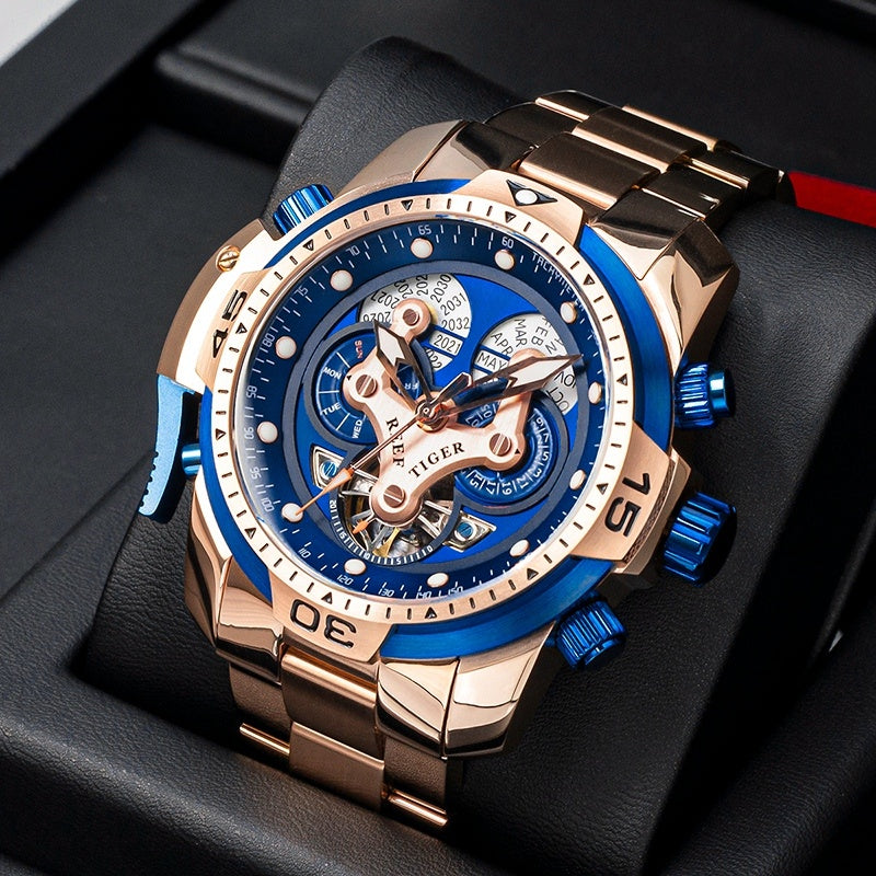 Rosé gold watch with blue and gold details, beautifully arranged in a high-end display box, emphasizing its unique and sophisticated style.