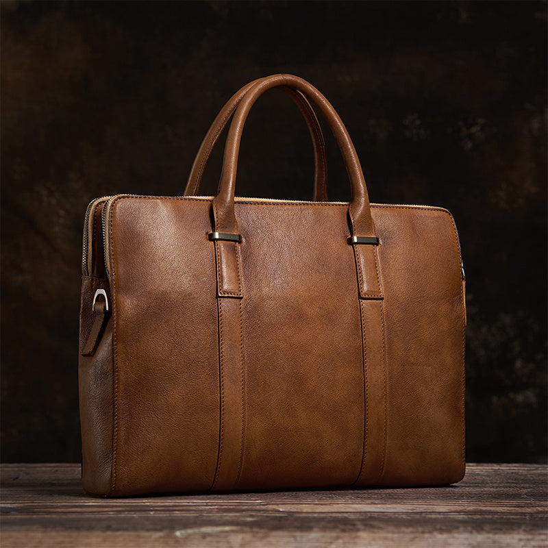 Detailed side view of the vegetable-tanned cowhide leather handbag, showcasing premium craftsmanship.