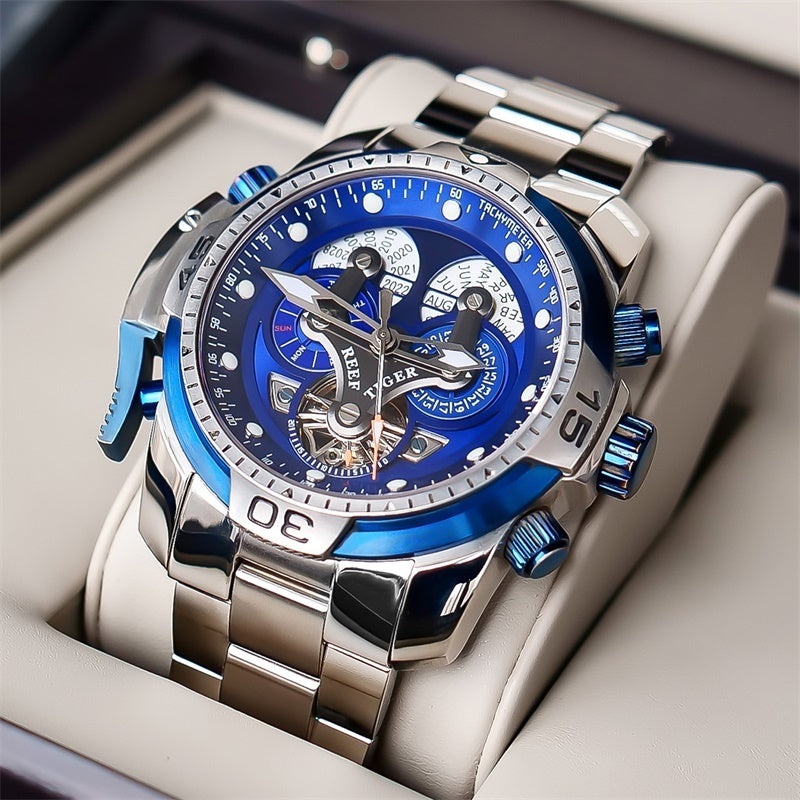 Stylish steel watch with a blue back and polished finish, elegantly displayed in a luxurious box, highlighting its modern and bold appeal.