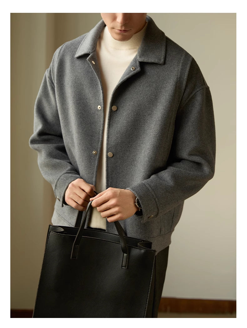 Close-up showcasing the tailored fit of the men’s lapel double-sided woolen coat, perfect for formal and business occasions.