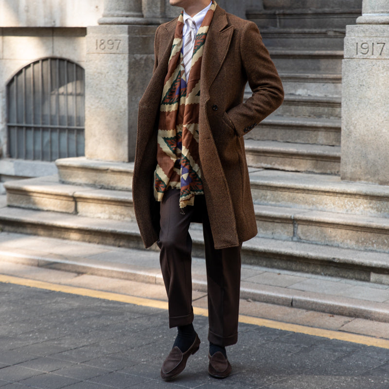 Full-length dark brown wool coat, showcasing its flattering fit and vintage-inspired double-breasted closure.