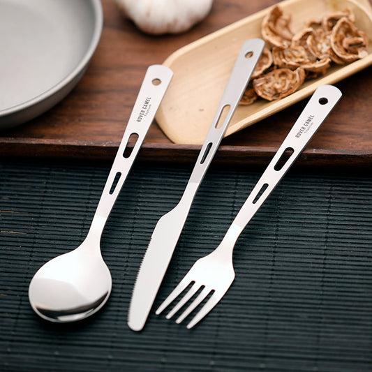 Sleek titanium cutlery set including knife, spoon, and fork for travel use