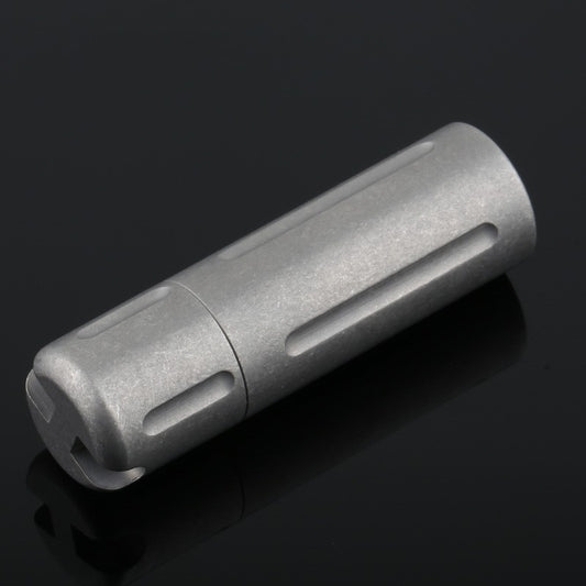 Front view of titanium sealed pill box with polished natural finish