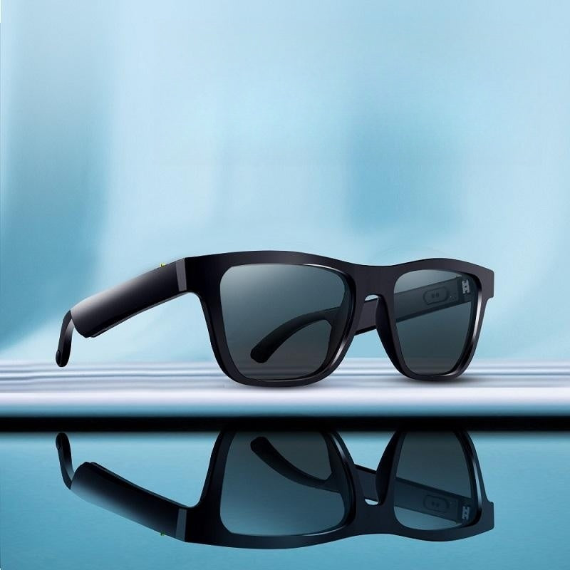 Contents of smart sunglasses box including charger and manual