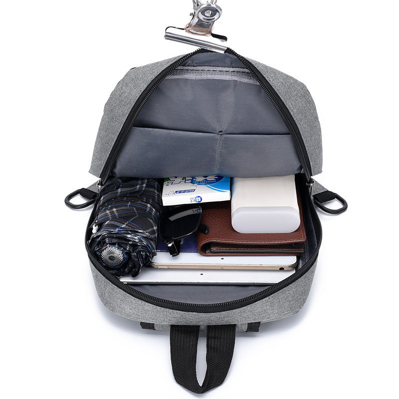 Inside view of men’s shoulder bag showing zippered pocket