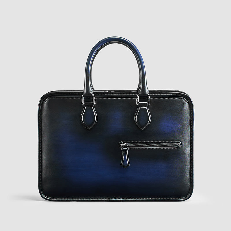 A close-up of the navy blue hand-rubbed vintage leather laptop bag, featuring premium craftsmanship.