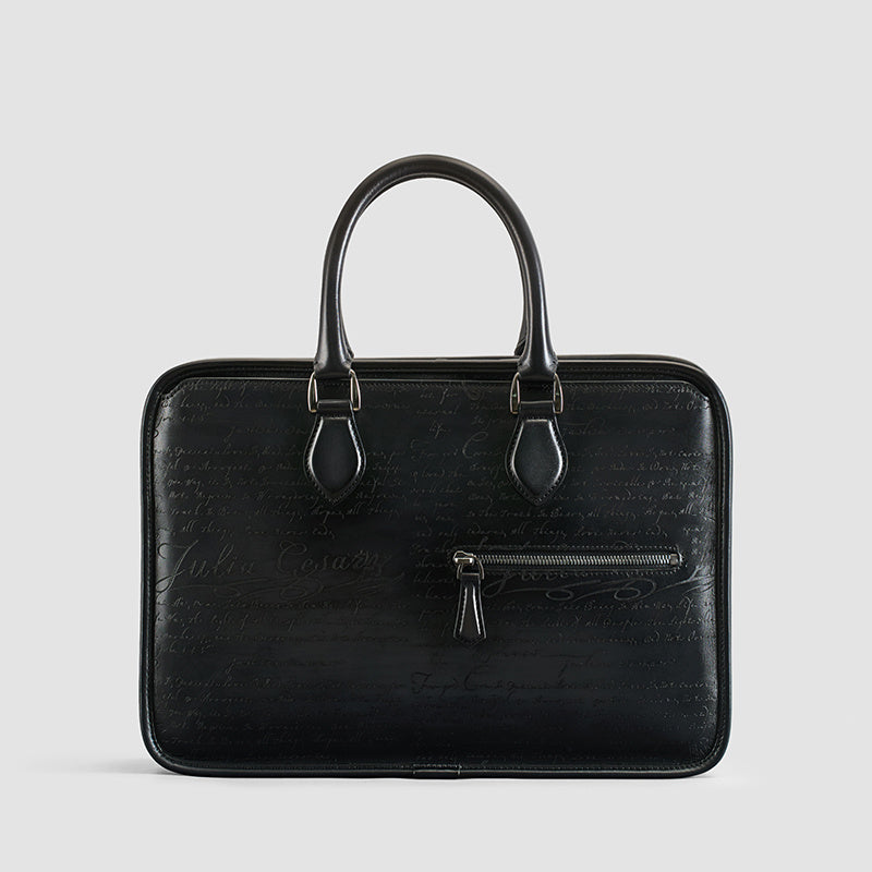 A sleek smokey grey hand-rubbed vintage leather laptop bag lettering, perfect for professionals on the go.