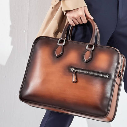 A hand-rubbed vintage leather office bag in a tobacco finish, exuding warmth and professionalism.