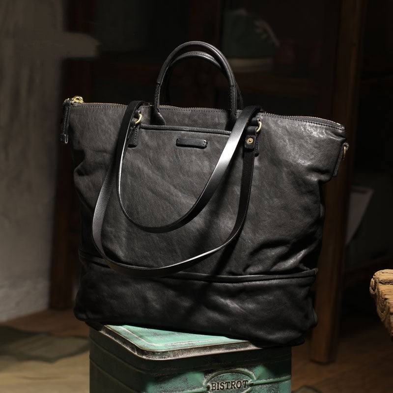 Black leather tote bag placed on a bistro stool, showcasing its retro charm.