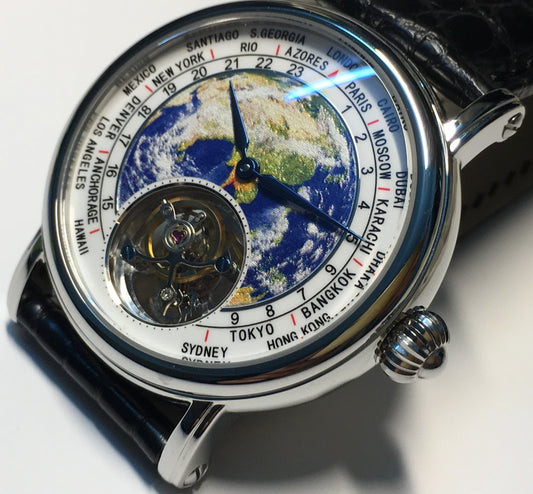 Close-up of the tourbillon watch featuring a world map dial and a black leather strap.